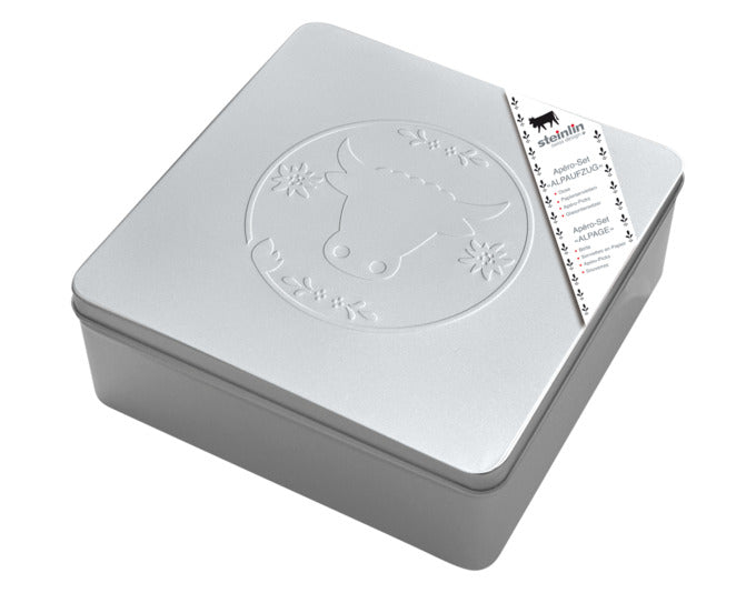 Entdecken Sie die stilvolle Weissblechdose Apèro-Box Alpaufzug von STEINLIN. Ideal für Apèro-Momente, nachhaltig und mit charmantem Design.