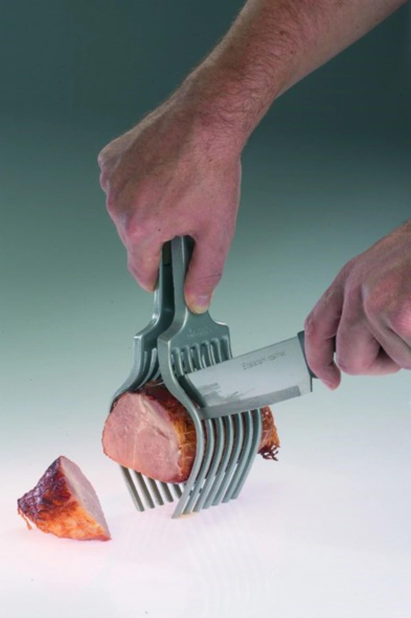 Die Westmark Tranchierhilfe Tranchetta (25.5x7.5x6.5cm) ermöglicht exaktes Schneiden von Fleisch und anderen Zutaten in der Küche.