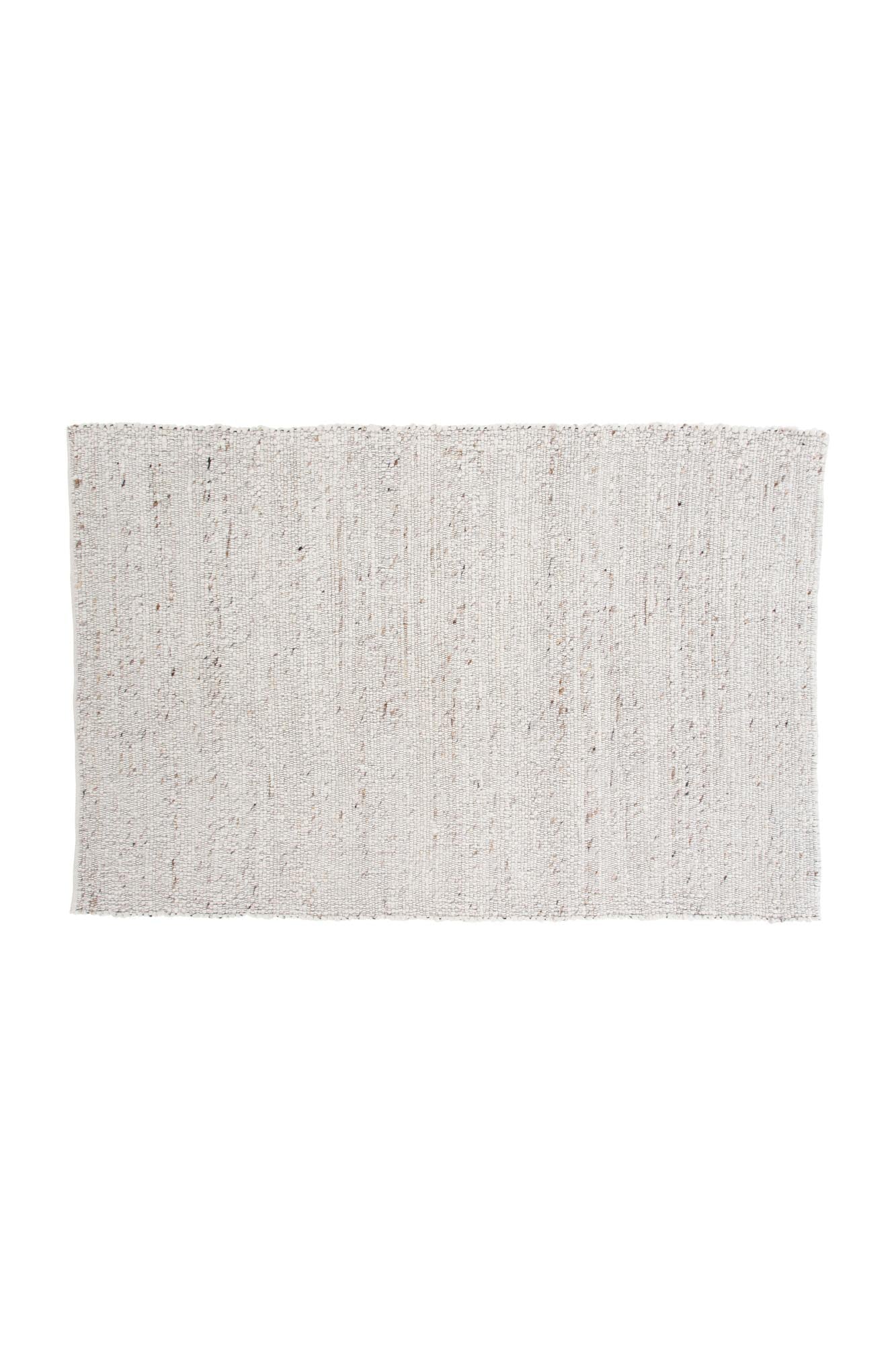 Der Loump Teppich von Venture Home ist ein handgewebter Wollteppich in Knochen- und Beigetönen mit gesprenkeltem Muster, 230x160 cm.