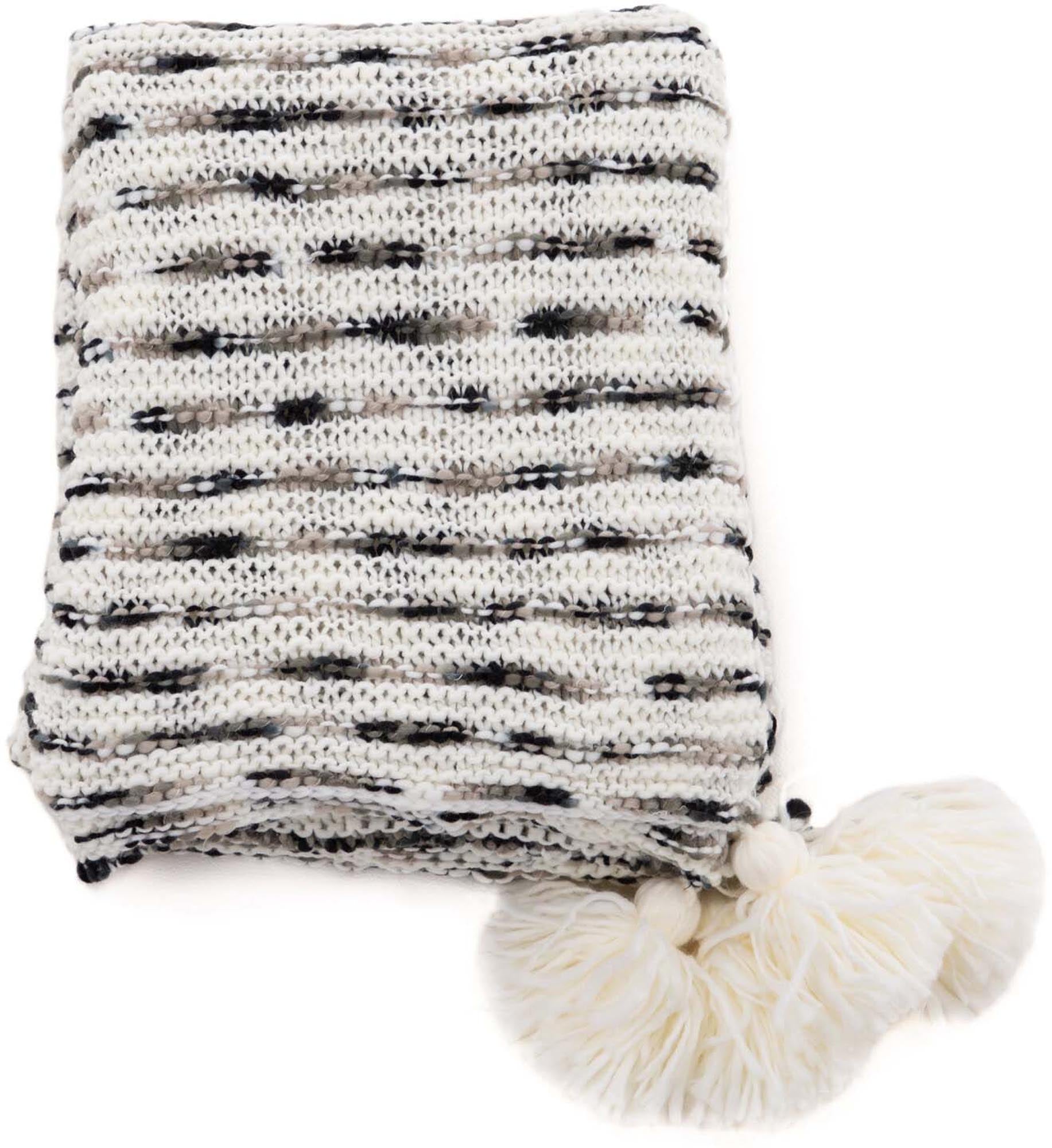 Unny Throw: Luxuriöse Wärme und zeitloses Design für Ihr Heim.