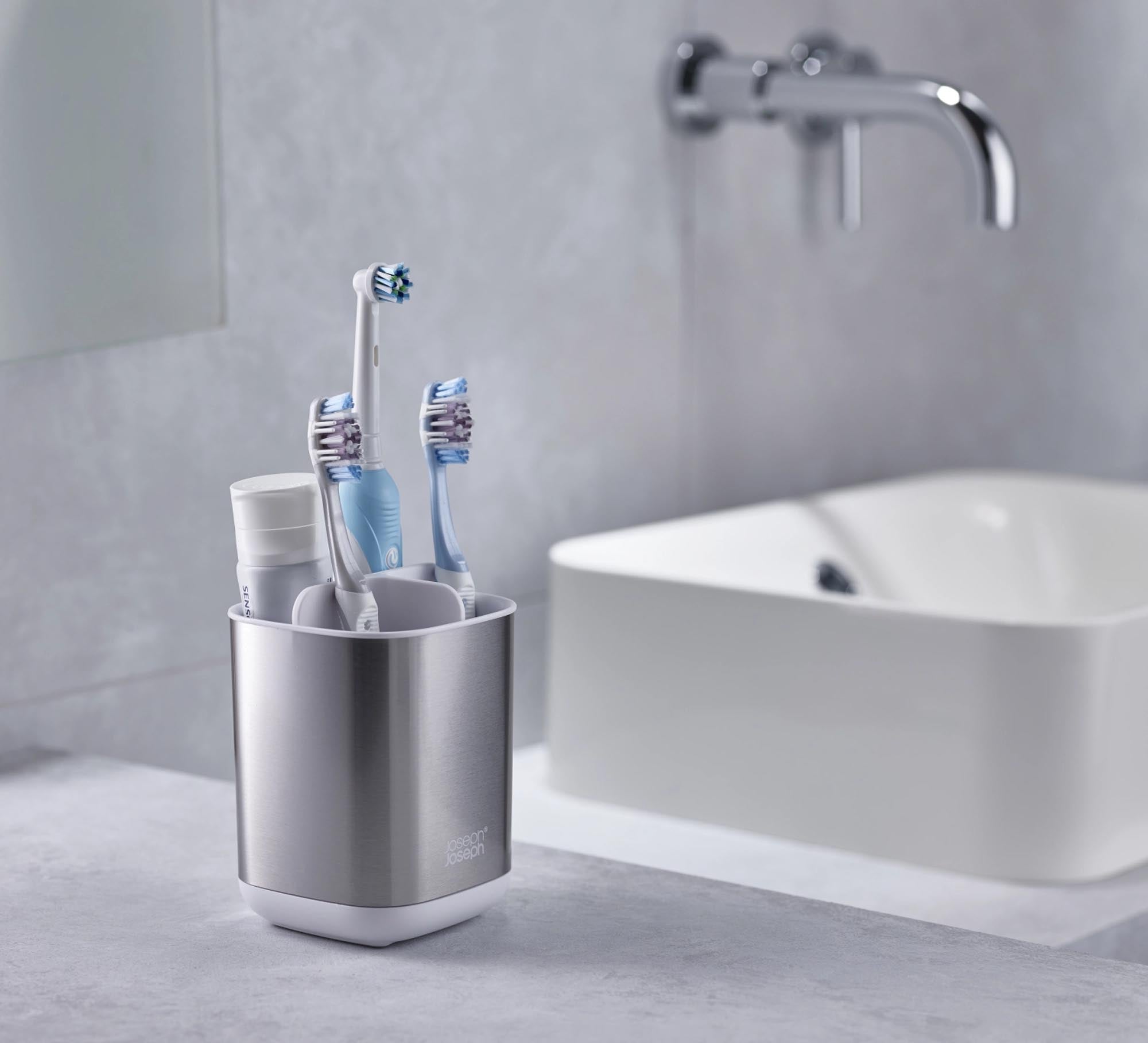 Stylischer Zahnbürstenhalter aus hochwertigem Edelstahl und ABS. Bietet Platz für 4 Zahnbürsten, hygienisch und einfach zu montieren. Ideal für jedes Badezimmer.