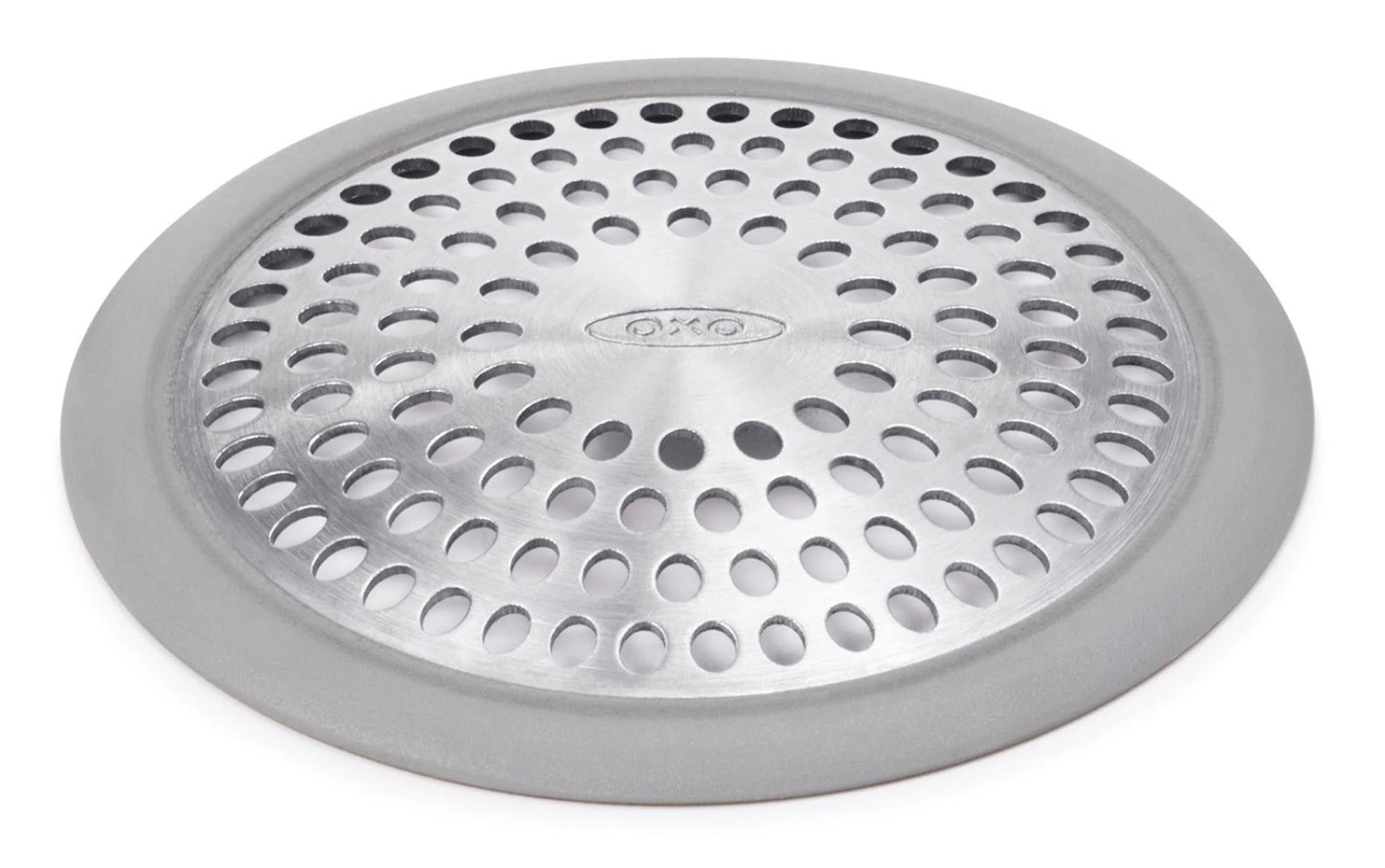 Eleganter OXO Abflussschutz: Rostfreier Edelstahl & flexibles Silikon schützen vor Haaren & Seifenresten. Universell & langlebig.
