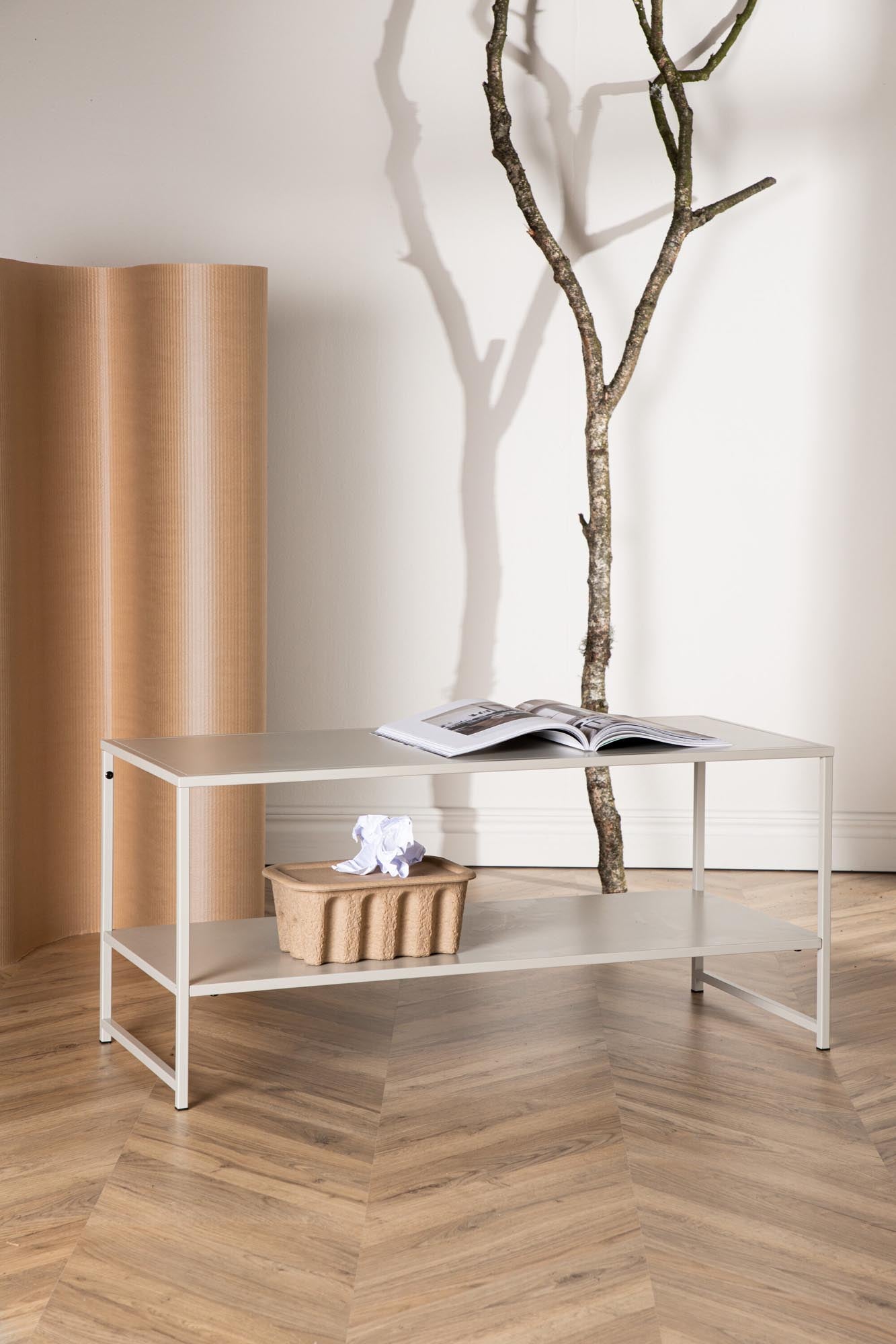 Eleganter Beistelltisch aus beigem Stahl: ideal für stilvolle Akzente im Wohnraum. Minimalistisches Design trifft auf praktische Funktionalität.