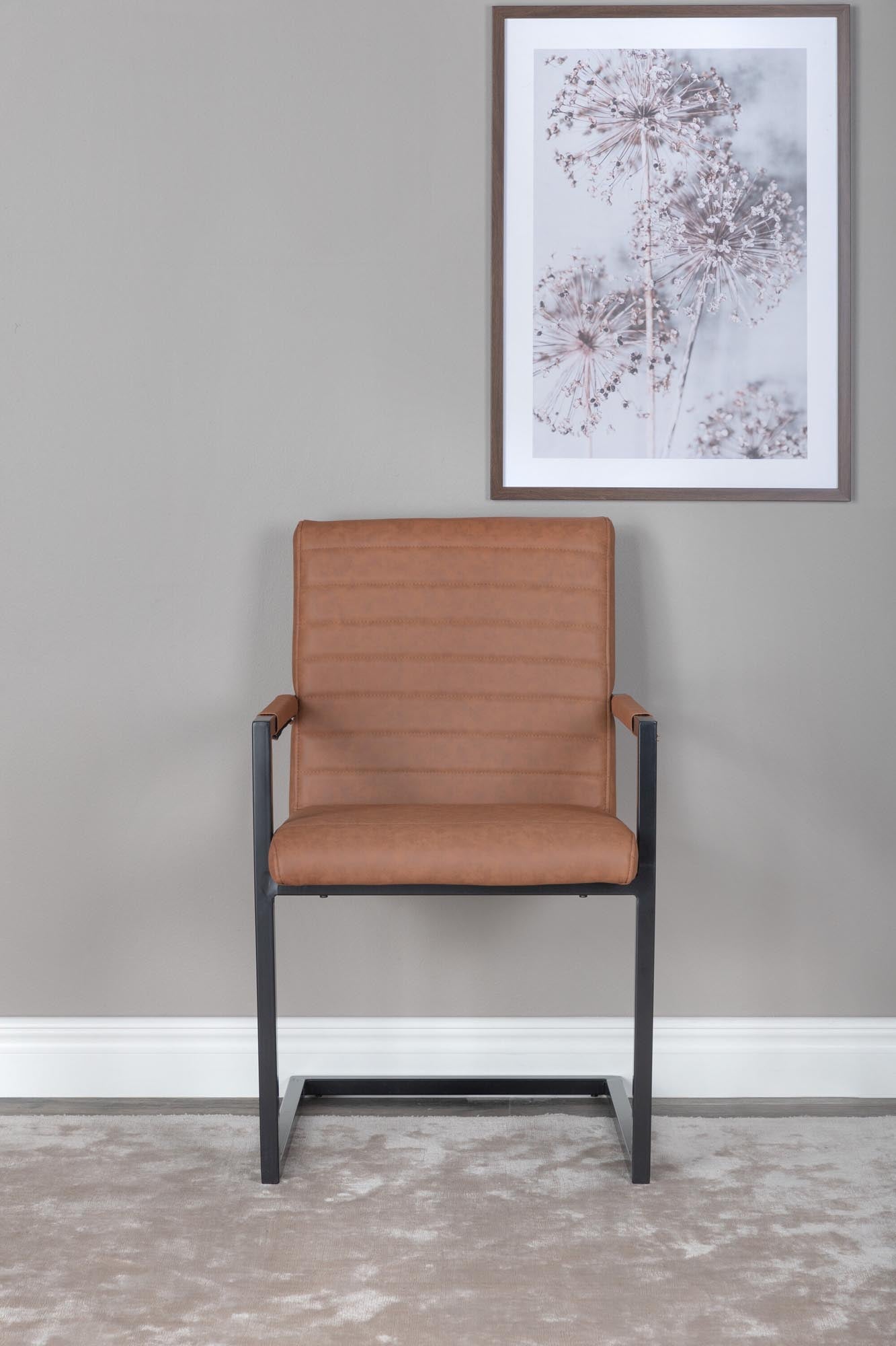 Moderner Kunststuhl von Venture Home: braunes Kunstleder, Ziernähte, Metallgestell, Komfort und Stil für Esszimmer oder Küche.