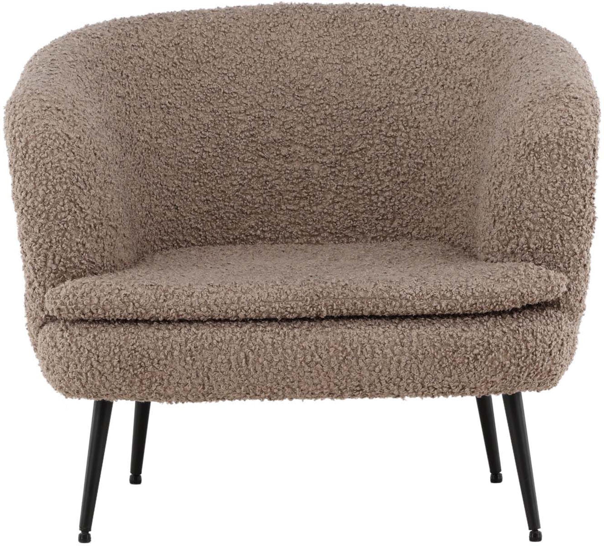 Erleben Sie den Nordkoster Sessel von Vind: Ein elegantes Möbelstück aus kuscheligem Teddystoff, das modernen Stil und höchsten Komfort vereint.