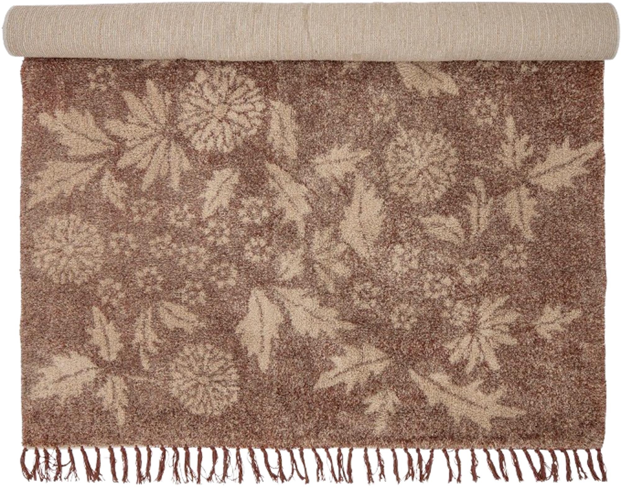 Der Malu Teppich von Creative Collection in Braun aus hochwertiger Baumwolle vereint Stil und Funktionalität mit einem eleganten Blumenmuster.