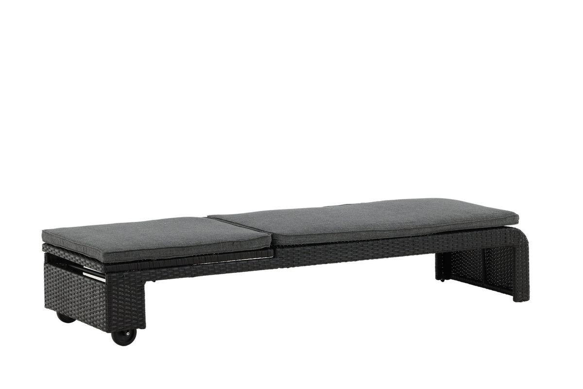 Sonnenliege London von Venture Home in Schwarz mit grauem Kissen und Korbgeflecht