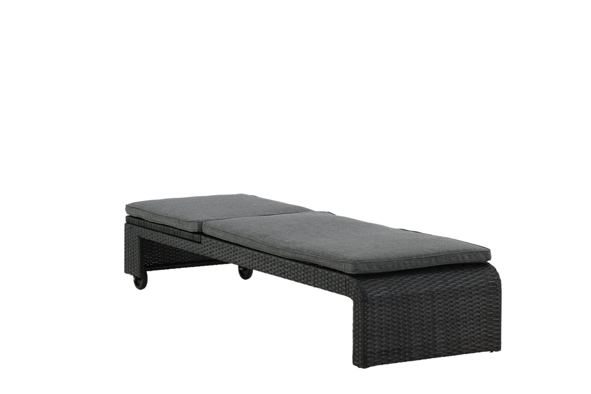 Sonnenliege London von Venture Home in Schwarz mit grauem Kissen und Korbgeflecht