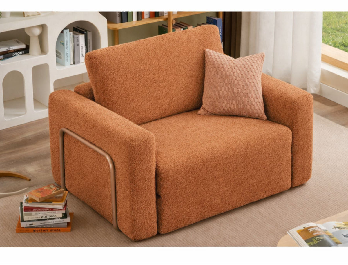 Orangefarbenes 1-Sitzer Schlafsofa aus Bouclé-Stoff mit kompakter Form, sichtbaren Füssen und leicht texturierter, flauschiger Oberfläche.