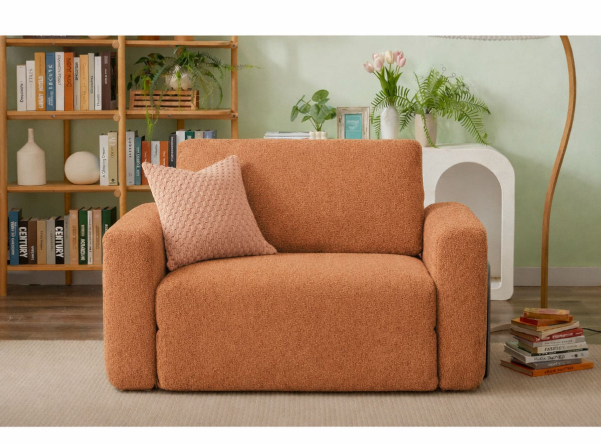 Orangefarbenes 1-Sitzer Schlafsofa aus Bouclé-Stoff mit kompakter Form, sichtbaren Füssen und leicht texturierter, flauschiger Oberfläche.