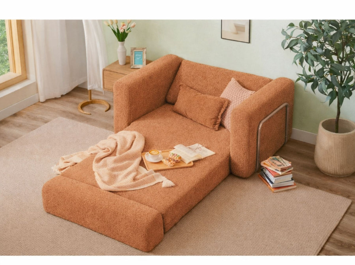 Orangefarbenes 1-Sitzer Schlafsofa aus Bouclé-Stoff mit kompakter Form, sichtbaren Füssen und leicht texturierter, flauschiger Oberfläche.