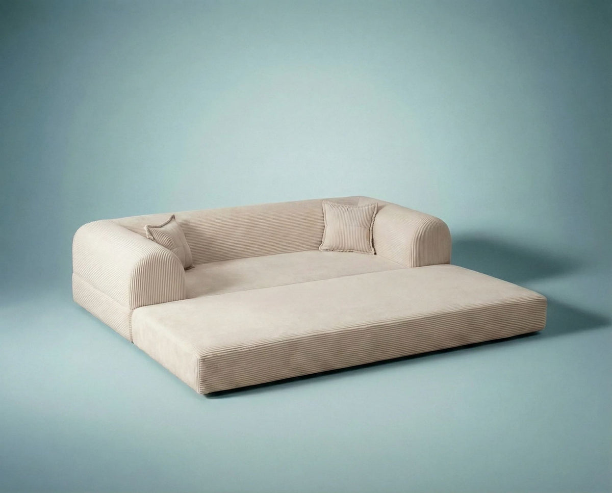 Cremefarbenes 3-Sitzer Schlafsofa Legom Eco von Hanah Home aus geripptem Cord-Plüschstoff mit zwei Kissen im Roll-Pack-Design abgebildet.