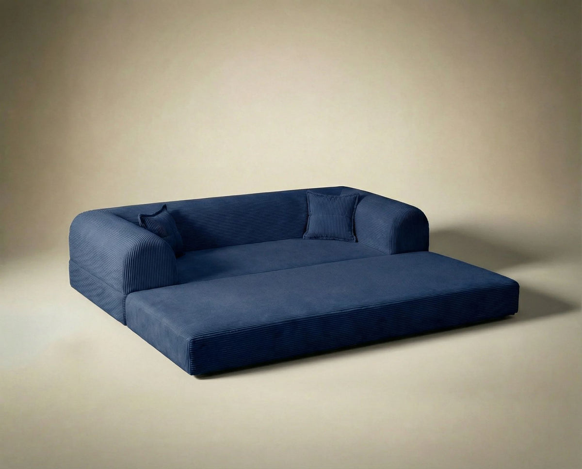 Marineblaues 3-Sitzer Schlafsofa Legom Eco von Hanah Home aus geripptem Cord-Plüschstoff mit zwei Kissen und niedrigem Rückenteil.