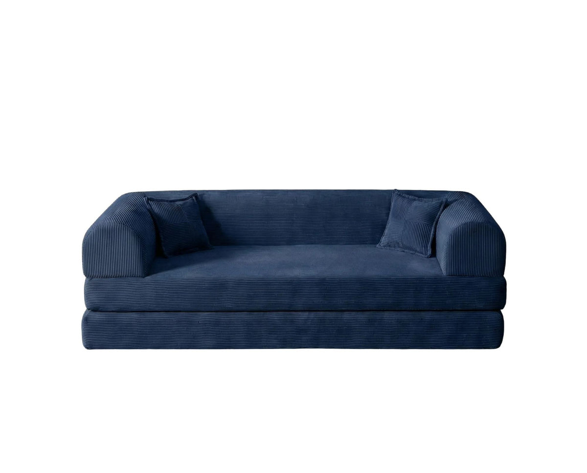 Marineblaues 3-Sitzer Schlafsofa Legom Eco von Hanah Home aus geripptem Cord-Plüschstoff mit zwei Kissen und niedrigem Rückenteil.