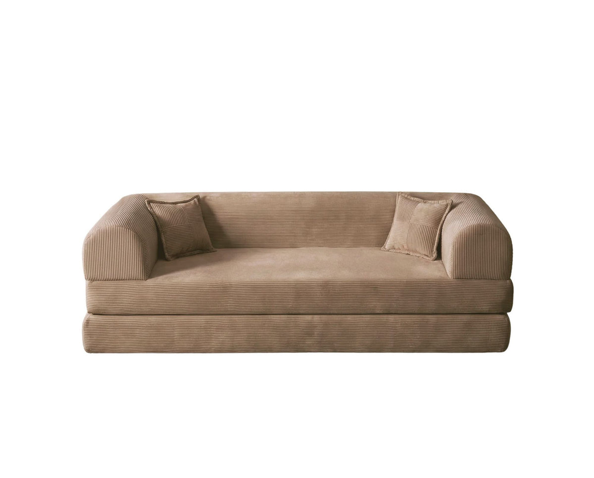 Beiges 3-Sitzer Schlafsofa aus geripptem Plüschstoff mit zwei Kissen, rutschfester Sohle und klar gerader Formgebung.