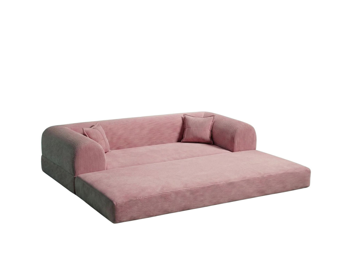Rosafarbenes 3-Sitzer Schlafsofa aus geripptem Cord-Plüschstoff mit zwei Kissen und rutschfester Sohle, Frontalansicht auf hellem Hintergrund.