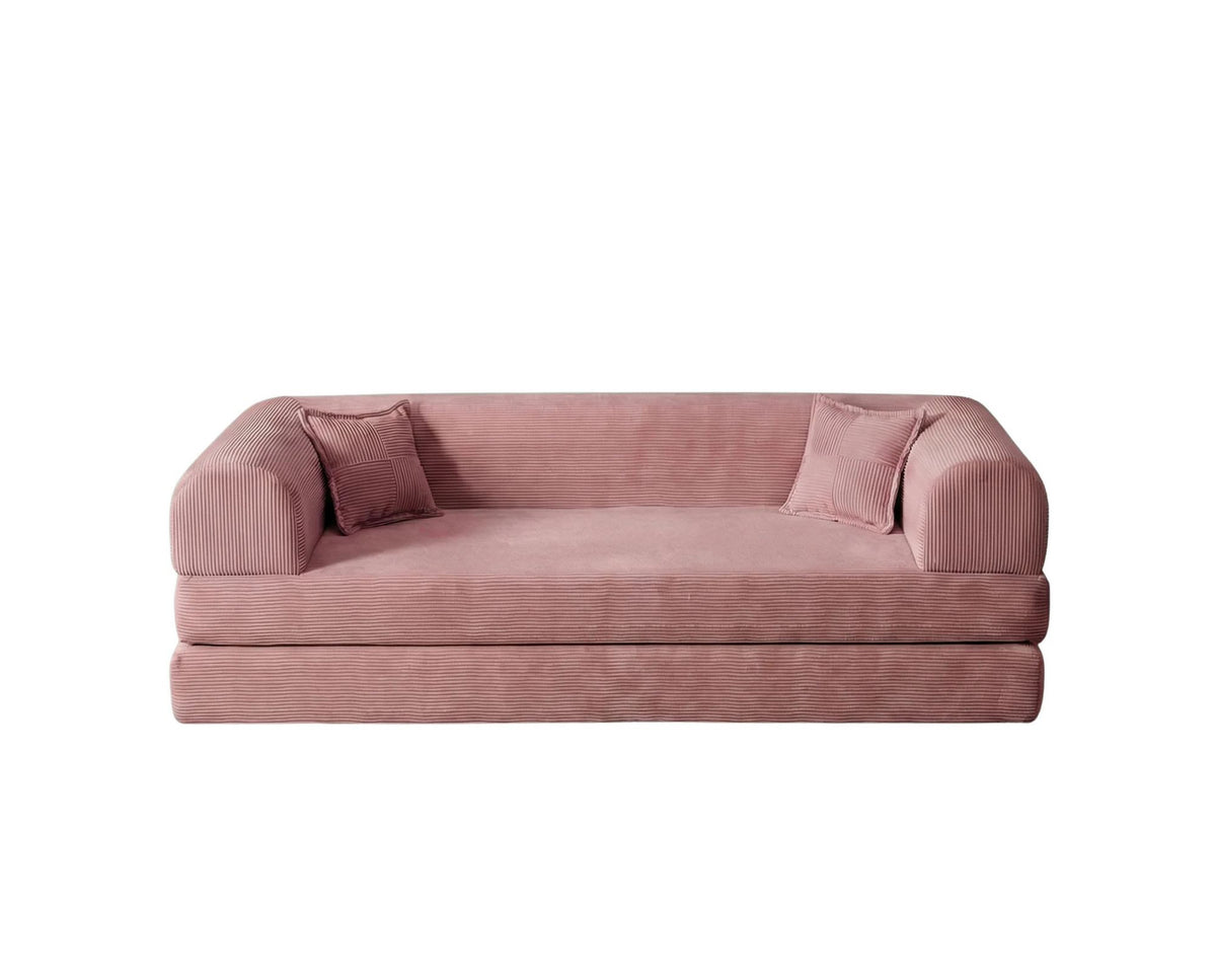 Rosafarbenes 3-Sitzer Schlafsofa aus geripptem Cord-Plüschstoff mit zwei Kissen und rutschfester Sohle, Frontalansicht auf hellem Hintergrund.