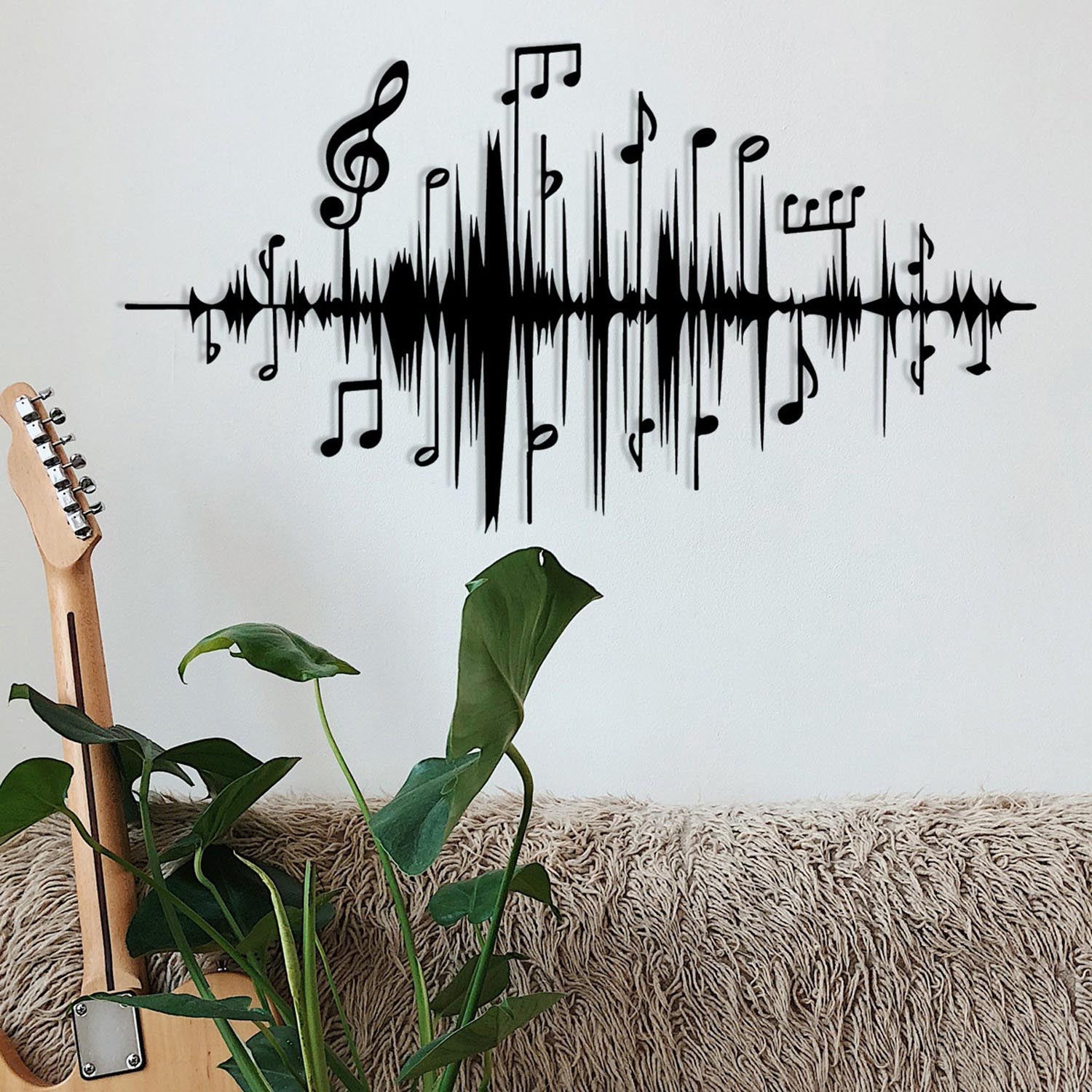 Entdecken Sie die elegante schwarze Wanddeko von Wallity. Dieses stilvolle Metall-Accessoire verwandelt jeden Raum in ein Kunstwerk.