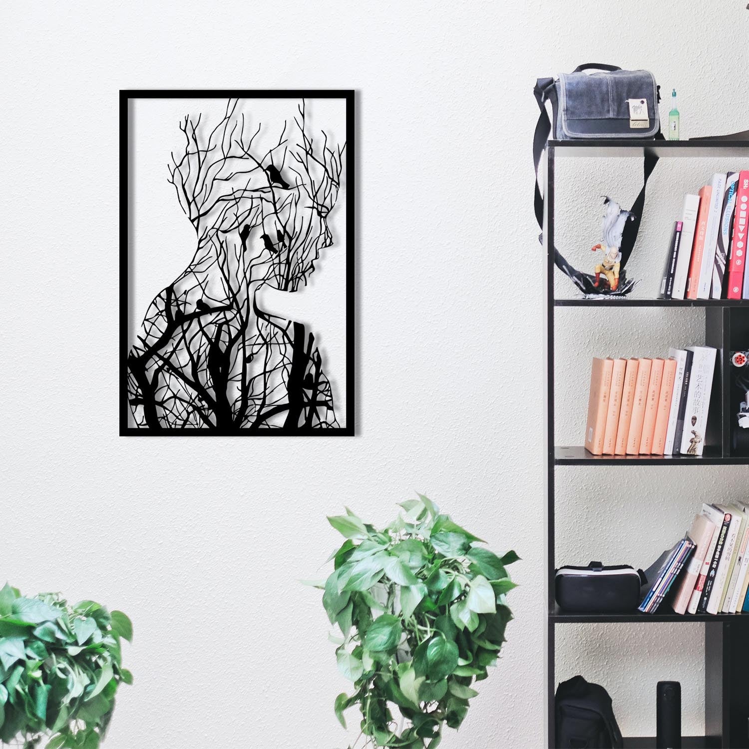 Entdecken Sie die elegante Arakan Wanddeko in Schwarz von Wallity. Verleihen Sie Ihrem Raum mit diesem stilvollen Metall-Accessoire einen modernen Akzent.