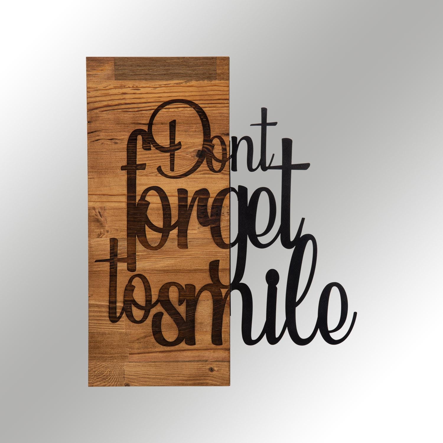 Gestalten Sie Ihre Wände mit der einzigartigen Wanddeko "Dont Forget To Smile" in edlem Schwarznuss von Wallity und bringen Sie Stil in Ihr Zuhause.