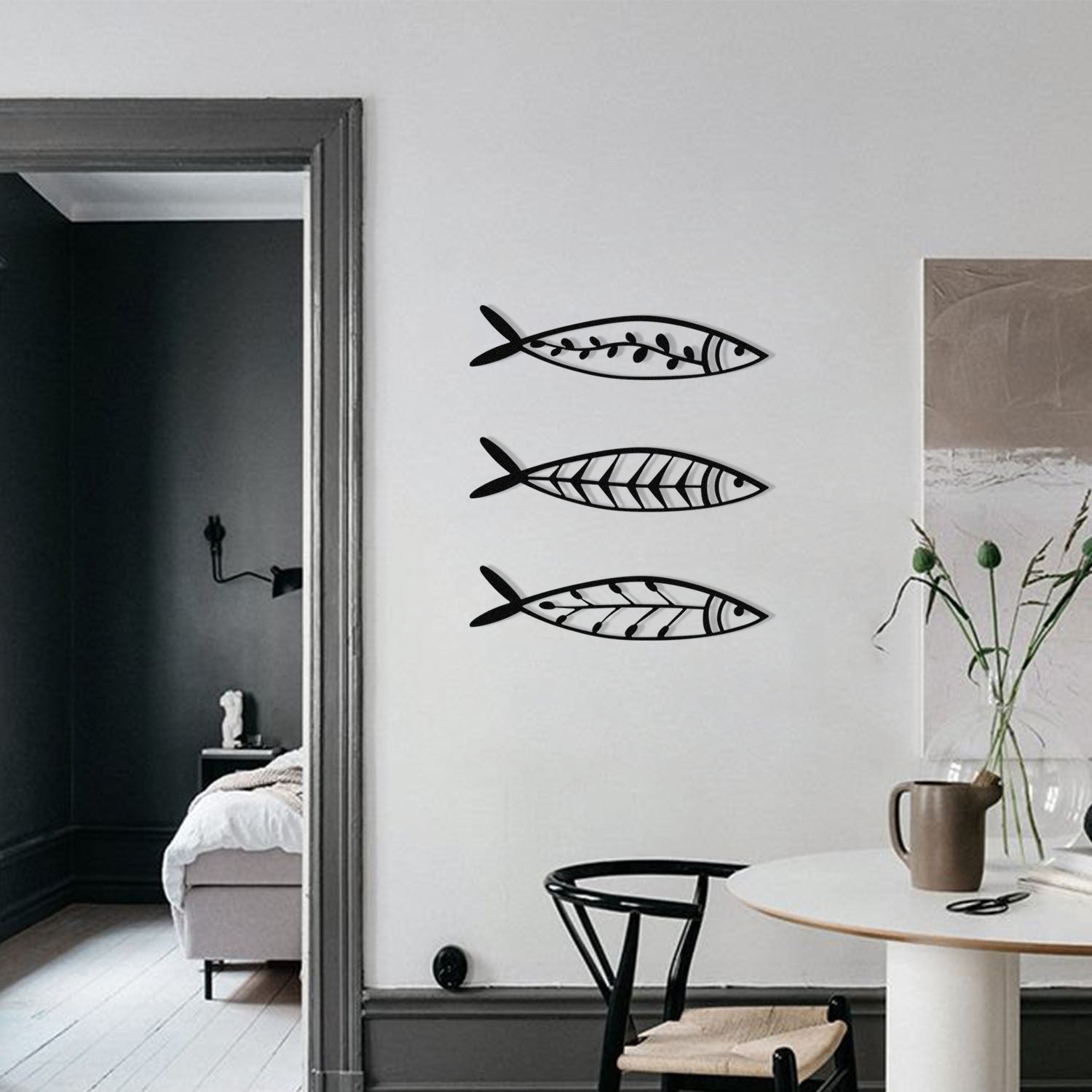 Verleihen Sie Ihrem Raum mit der Hamsi Wanddeko von Wallity in Schwarz einen modernen Touch. Robustes Metall, vielseitig und einfach zu montieren!
