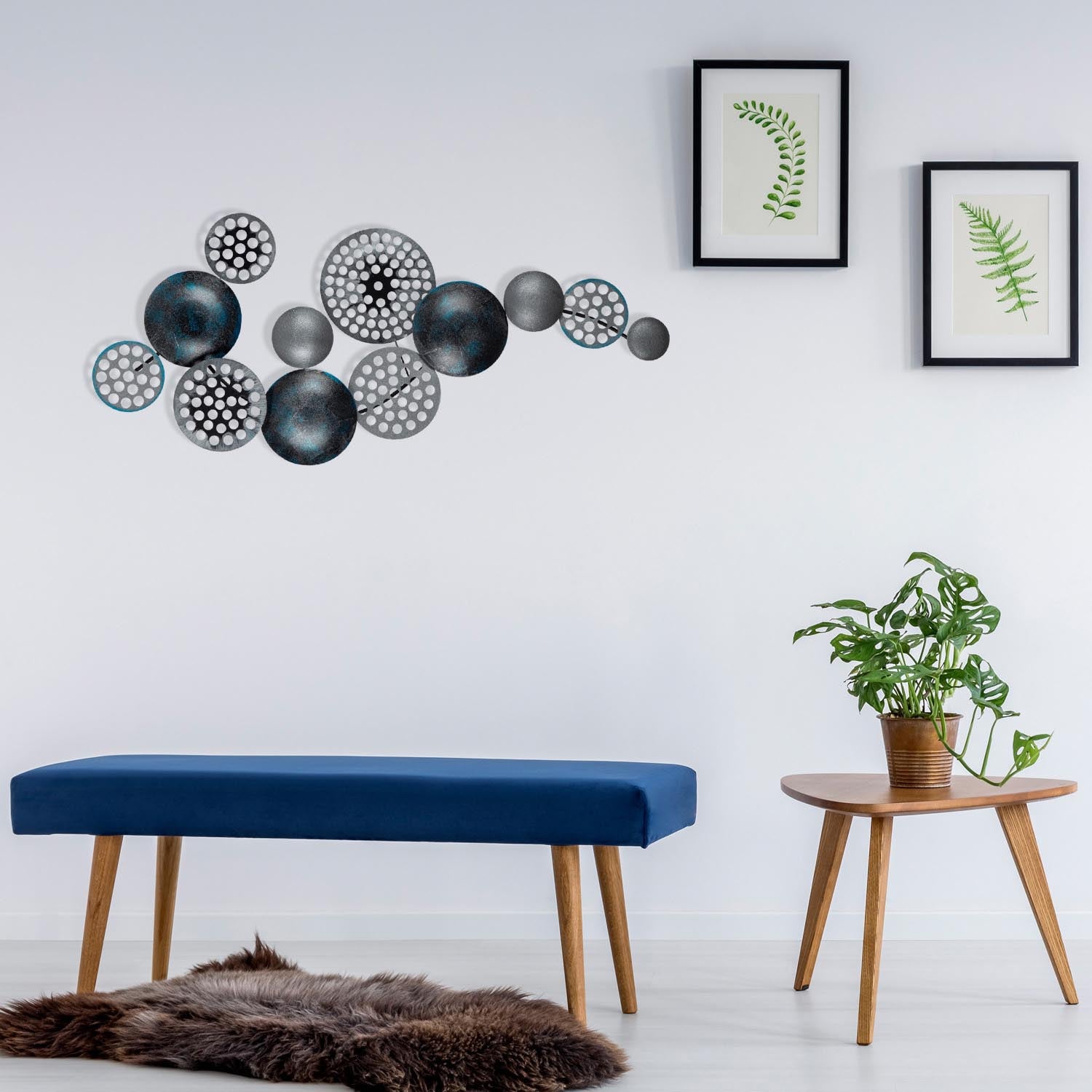 Gestalten Sie Ihre Wände neu mit der mehrfarbigen Bronte Wanddeko von Wallity. Dieses stilvolle Metallaccessoire vereint Eleganz und Langlebigkeit.