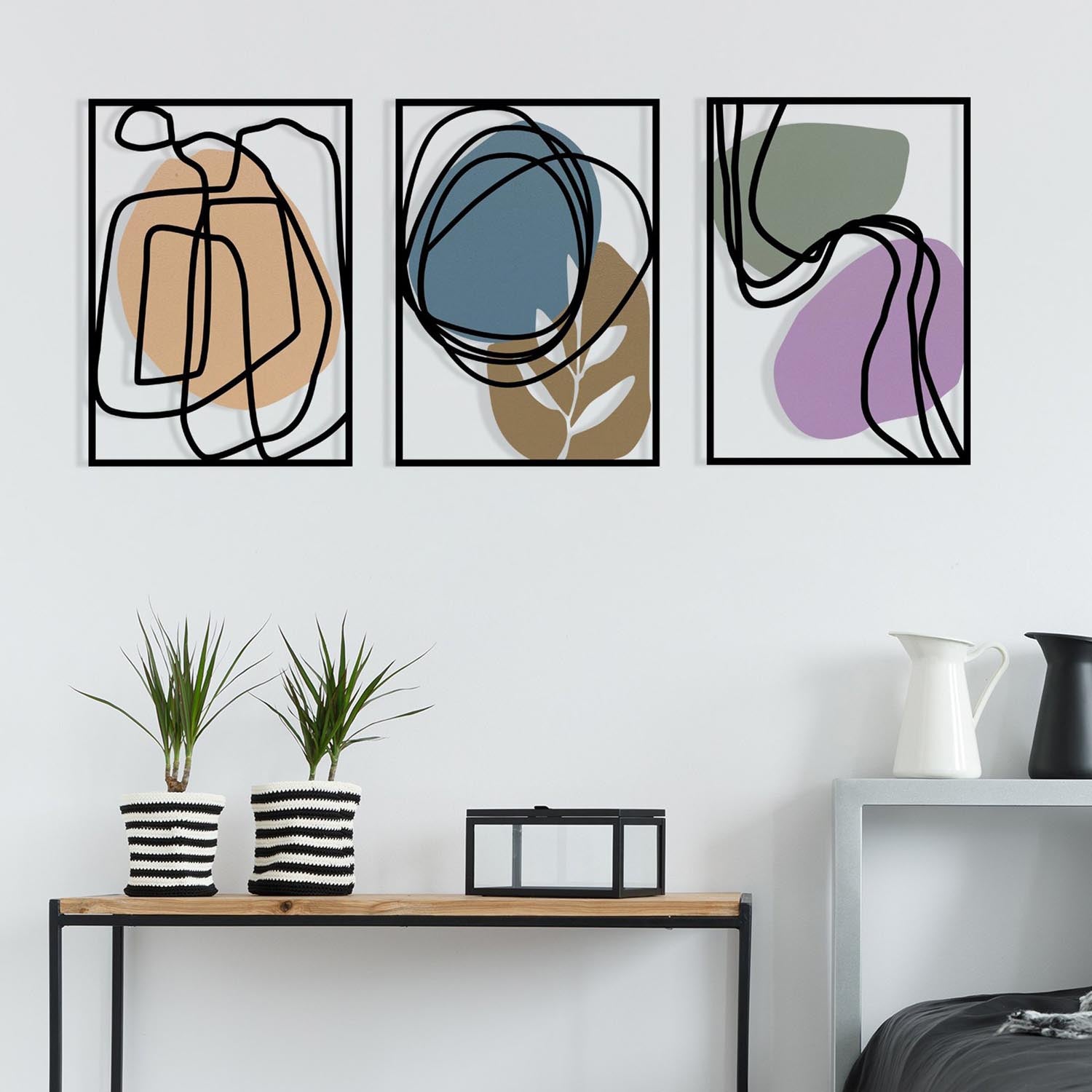 Entdecken Sie die Viyana Wanddeko von Wallity – ein elegantes, mehrfarbiges Metallkunstwerk, das jeden Raum stilvoll aufwertet.