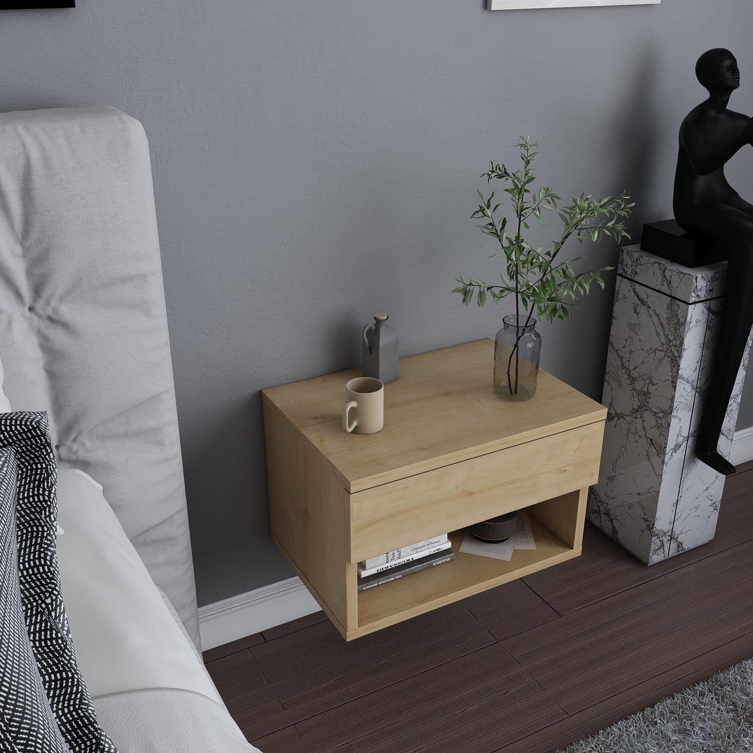 Verleihen Sie Ihrem Schlafzimmer mit dem Jamot Nachttisch in Eiche von Hanah Home einen Hauch von skandinavischer Eleganz und zeitloser Gemütlichkeit.