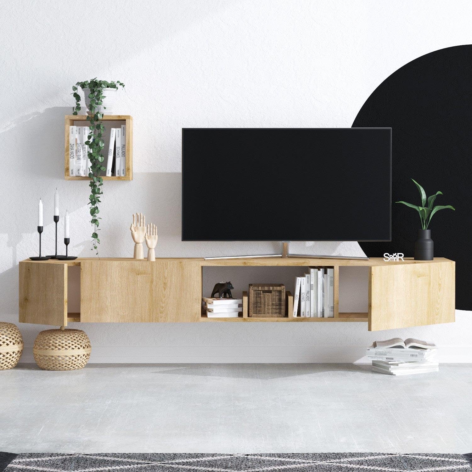 Verleihen Sie Ihrem Wohnzimmer mit dem Avior TV-Möbel in Saphir-Eiche von Hanah Home einen Hauch von Eleganz und Funktionalität. Ideal für Ihre Mediengeräte!