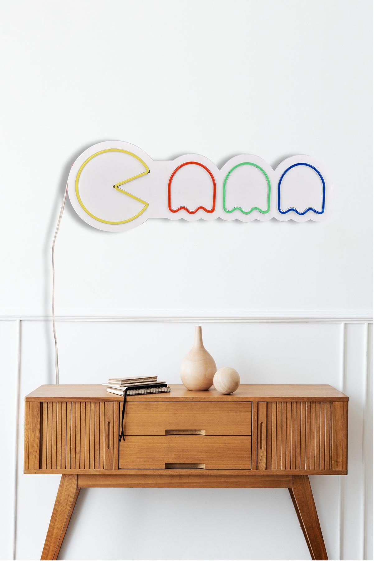 Verleihen Sie Ihrem Raum mit der Pacman Wandleuchte von Wallity einen einzigartigen, bunten Flair! Ideal für kreative Lichtakzente.