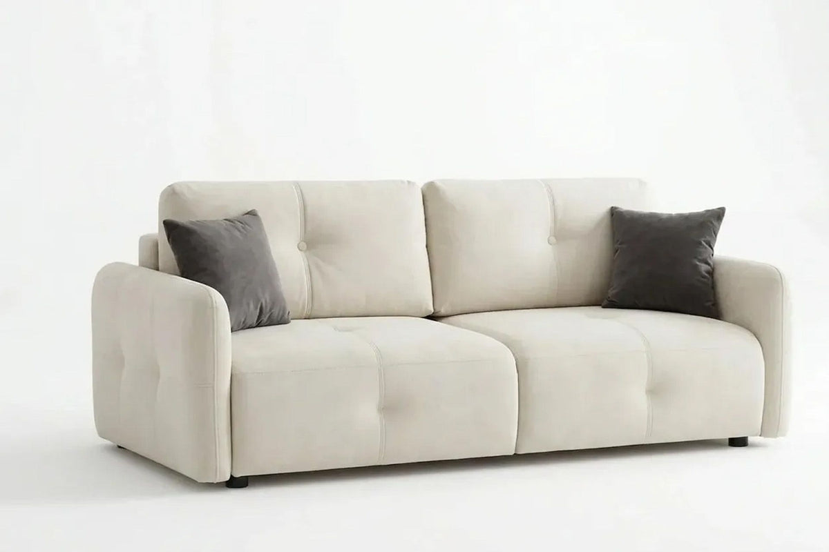 Ecrufarbenes 3-Sitzer Schlafsofa Magic von Hanah Home mit Polyesterbezug, Buchenholzgestell und Kunststoffbeinen im Wohnraum.
