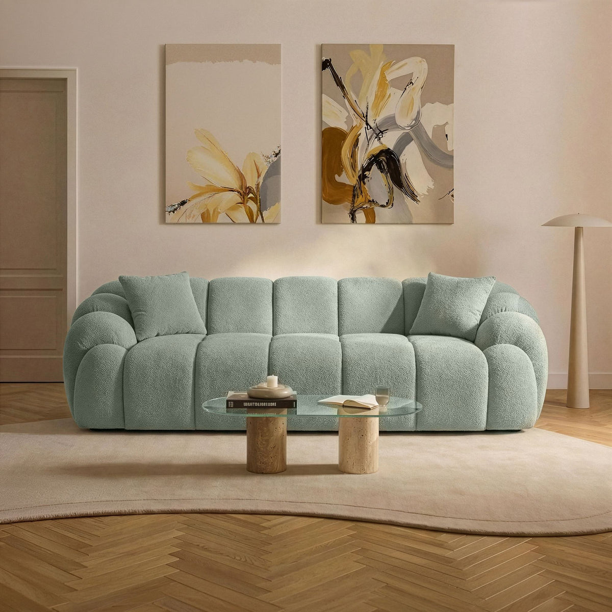 Türkisfarbenes 3-Sitzer Sofa Octavio von Hanah Home mit Polyesterstoff, Holzgestell, schlanken Kunststoffbeinen und zwei losen Kissen.
