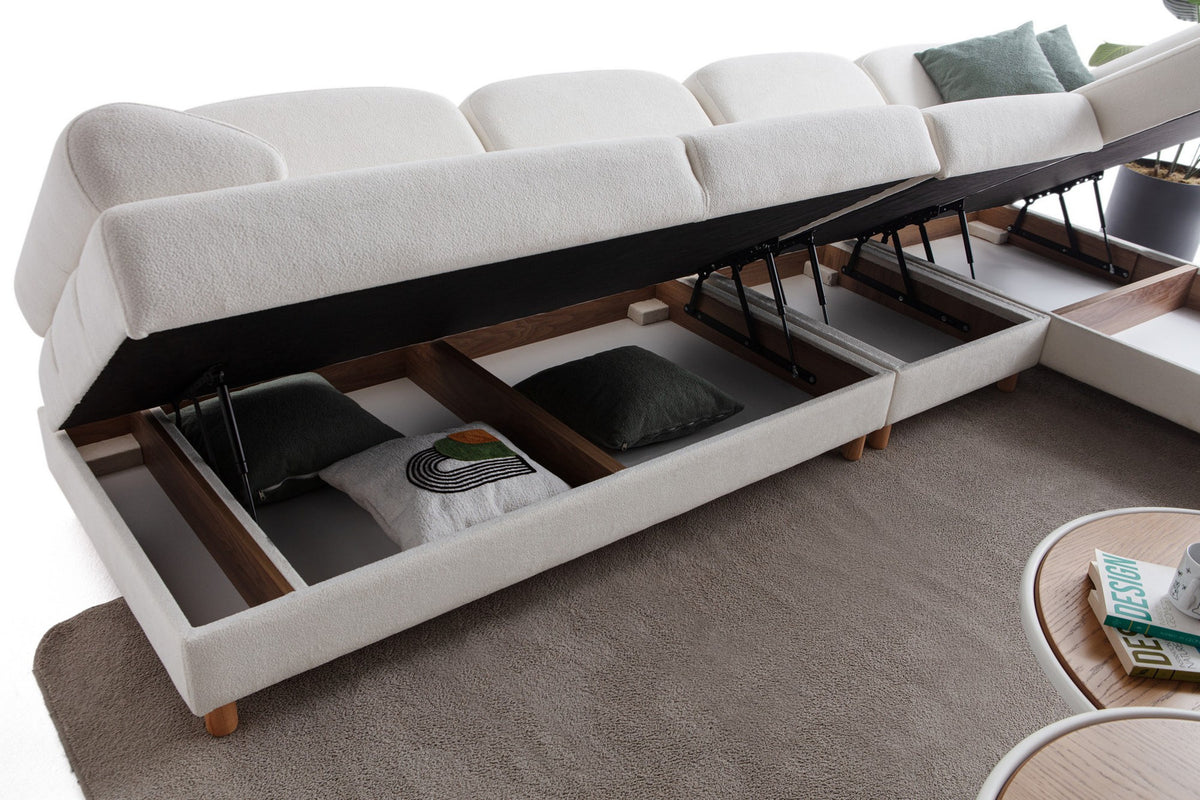 Weisses Eck-Schlafsofa Aries Relax Joker mit Coco-Boucle-Stoff, Holzbeinen und integrierter Aufbewahrungstruhe, rechte Ausführung, Ansicht von vorne.