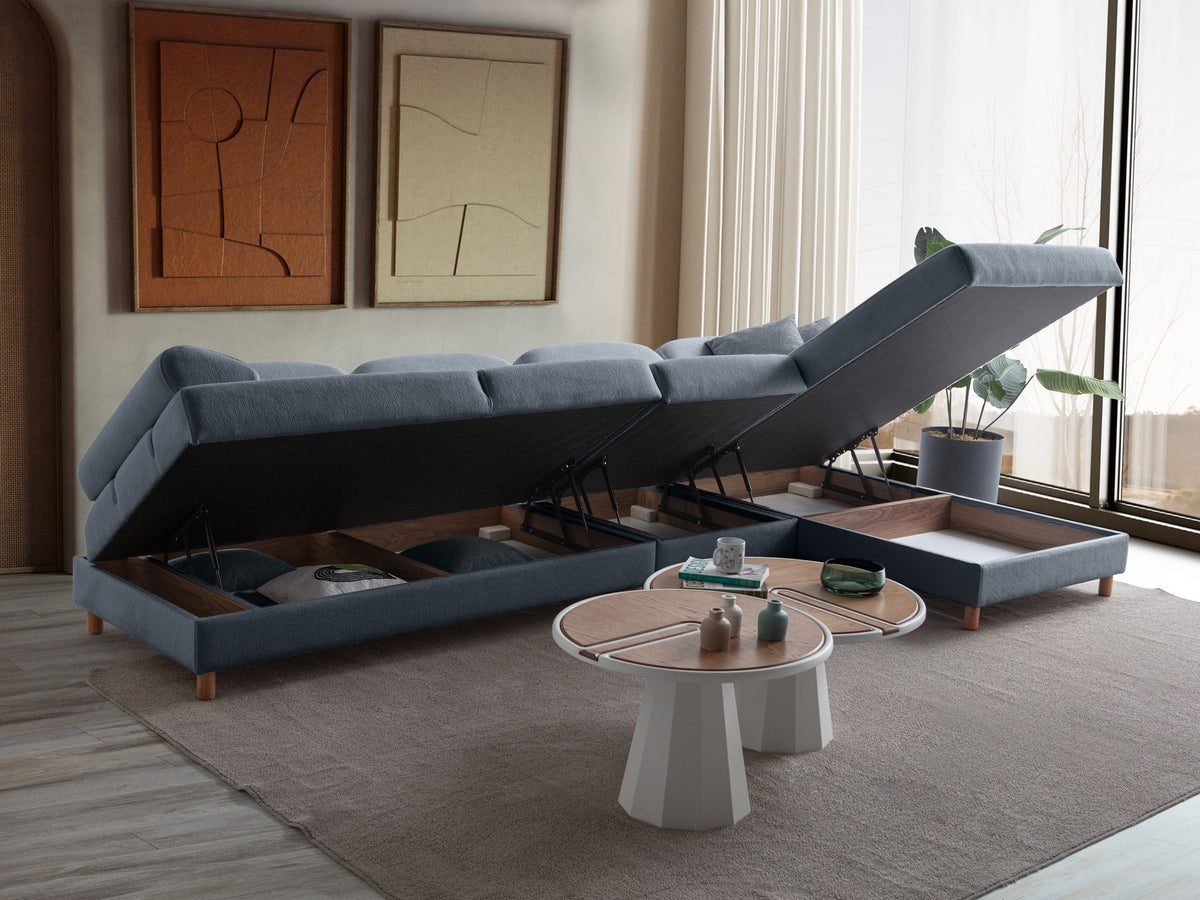 Marineblaues Eck-Schlafsofa Aries Relax Joker von Hanah Home mit Coco-Boucle-Stoffbezug, Holzbeinen und ausklappbarer Liegefläche.