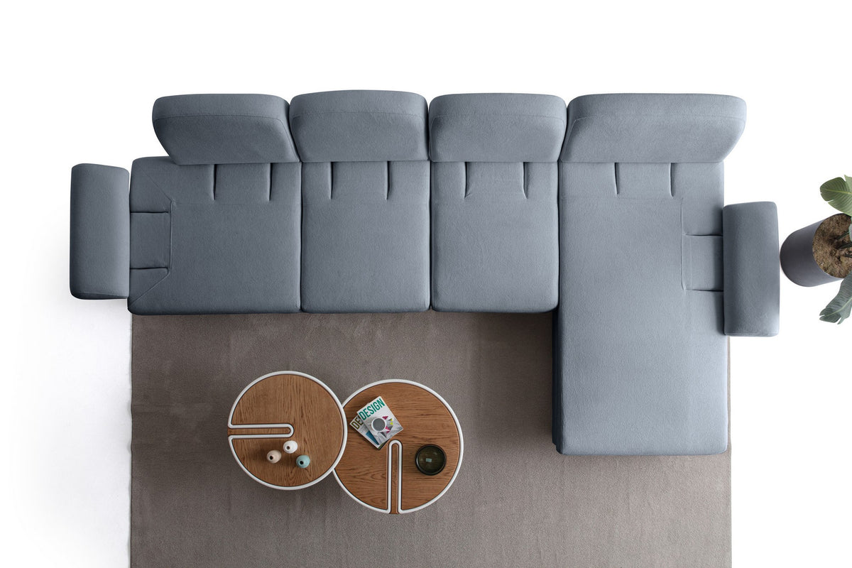 Marineblaues Eck-Schlafsofa Aries Relax Joker von Hanah Home mit Coco-Boucle-Stoffbezug, Holzbeinen und ausklappbarer Liegefläche.