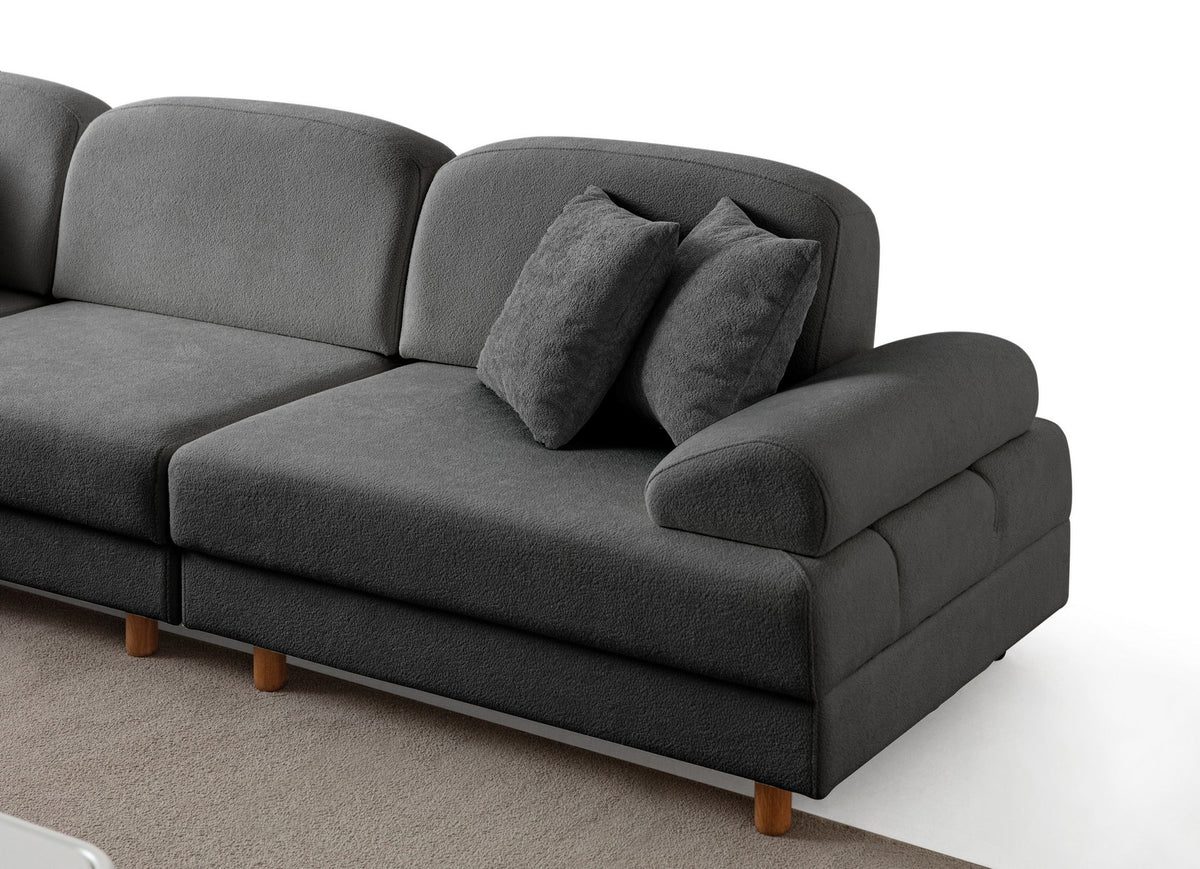 Anthrazitfarbenes Eck-Schlafsofa mit Boucle-Stoffbezug, Holzbeinen und Aufbewahrungstruhe, fotografiert in modularer L-Form.