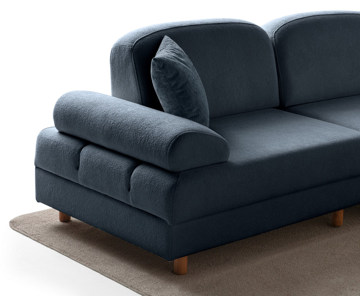 Marineblaues Eck-Schlafsofa Aries Modular M von Hanah Home mit Coco-Boucle-Stoffbezug, Holzbeinen und ausklappbarer Liegefläche.