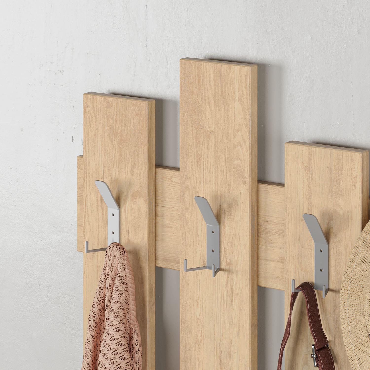 Verleihen Sie Ihrem Raum mit dem Wave Kleiderhaken aus Eiche von Hanah Home einen Hauch von Eleganz und Funktionalität – ideal für jeden Flur!