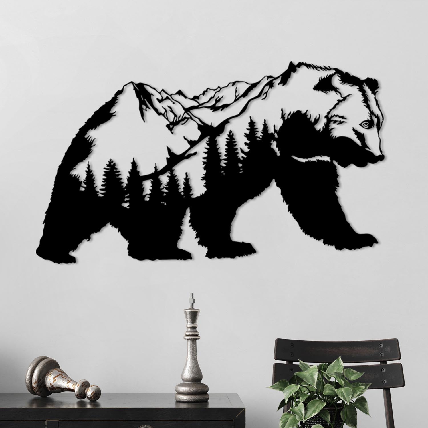 Entdecken Sie die elegante Orso Wanddeko in Schwarz von Wallity. Dieses stilvolle Metallkunstwerk verwandelt jeden Raum in ein modernes Highlight.