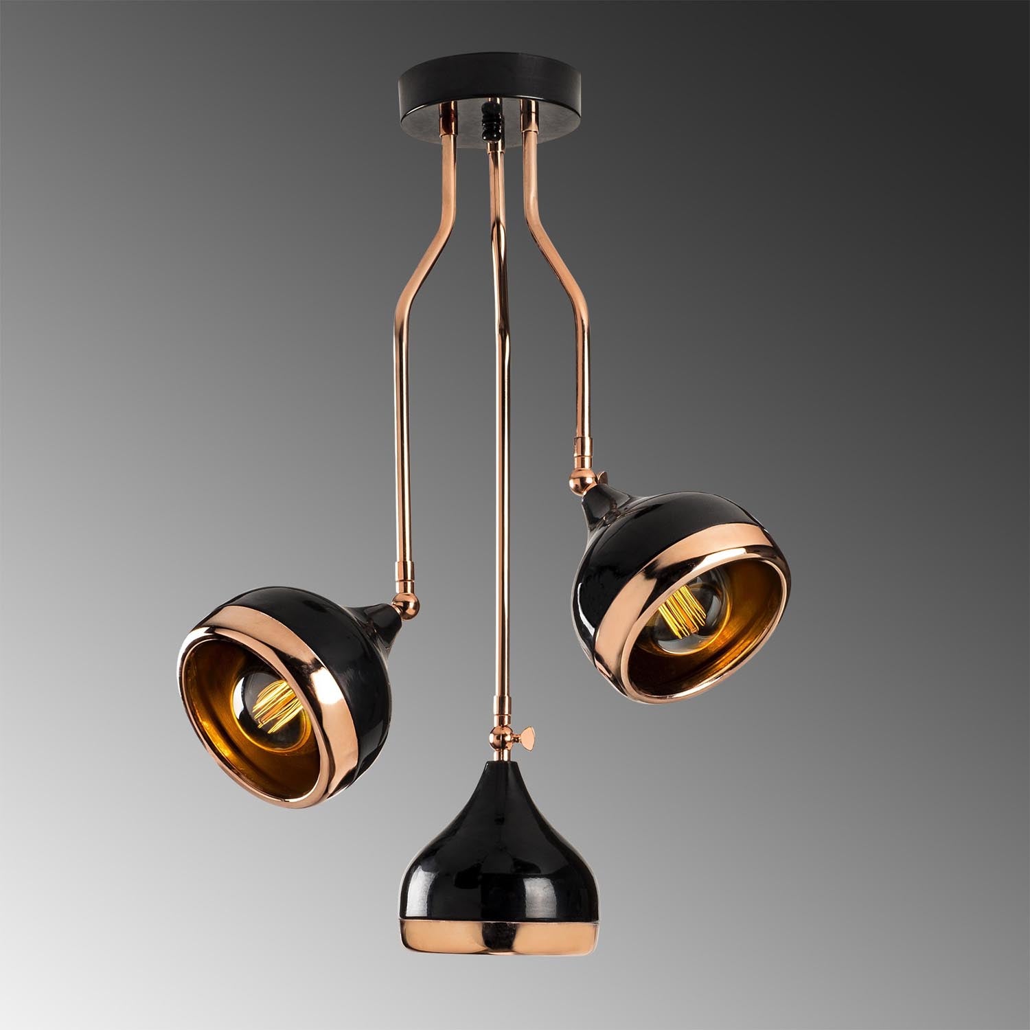 Verleihen Sie Ihrem Zuhause mit der Yıldo Pendelleuchte von Opviq in Schwarz und Kupfer einen modernen Touch. Ihr elegantes Design und die anpassbare Höhe machen sie zum perfekten Blickfang.