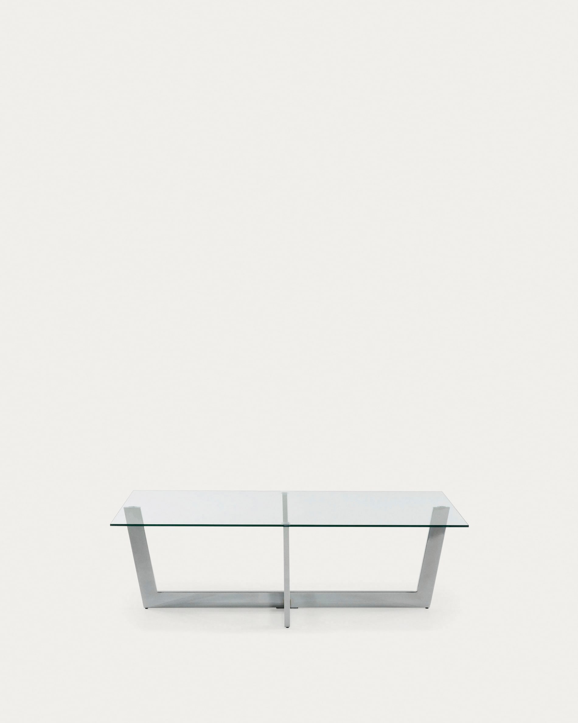 Moderner Couchtisch mit transparenter Glasplatte und verchromter Stahlstruktur, Masse 120x70 cm, von Kave Home.