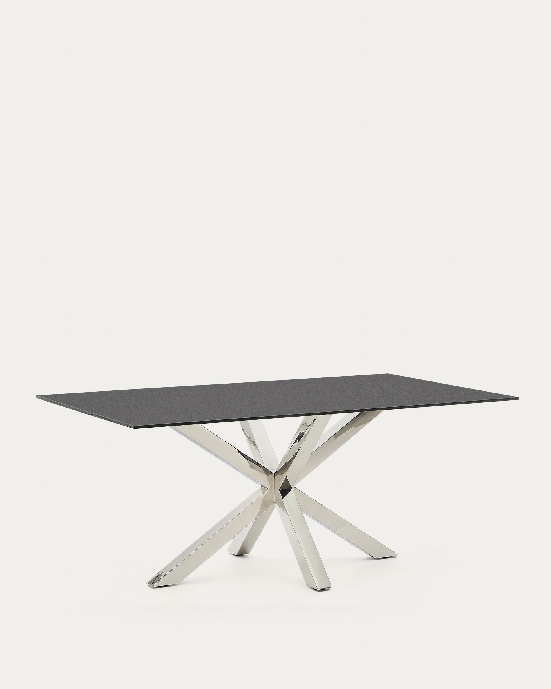 Der Tisch Argo besticht durch seine schwarze Milchglasplatte und Edelstahlbeine, ideal für stilvolle Zusammenkünfte.