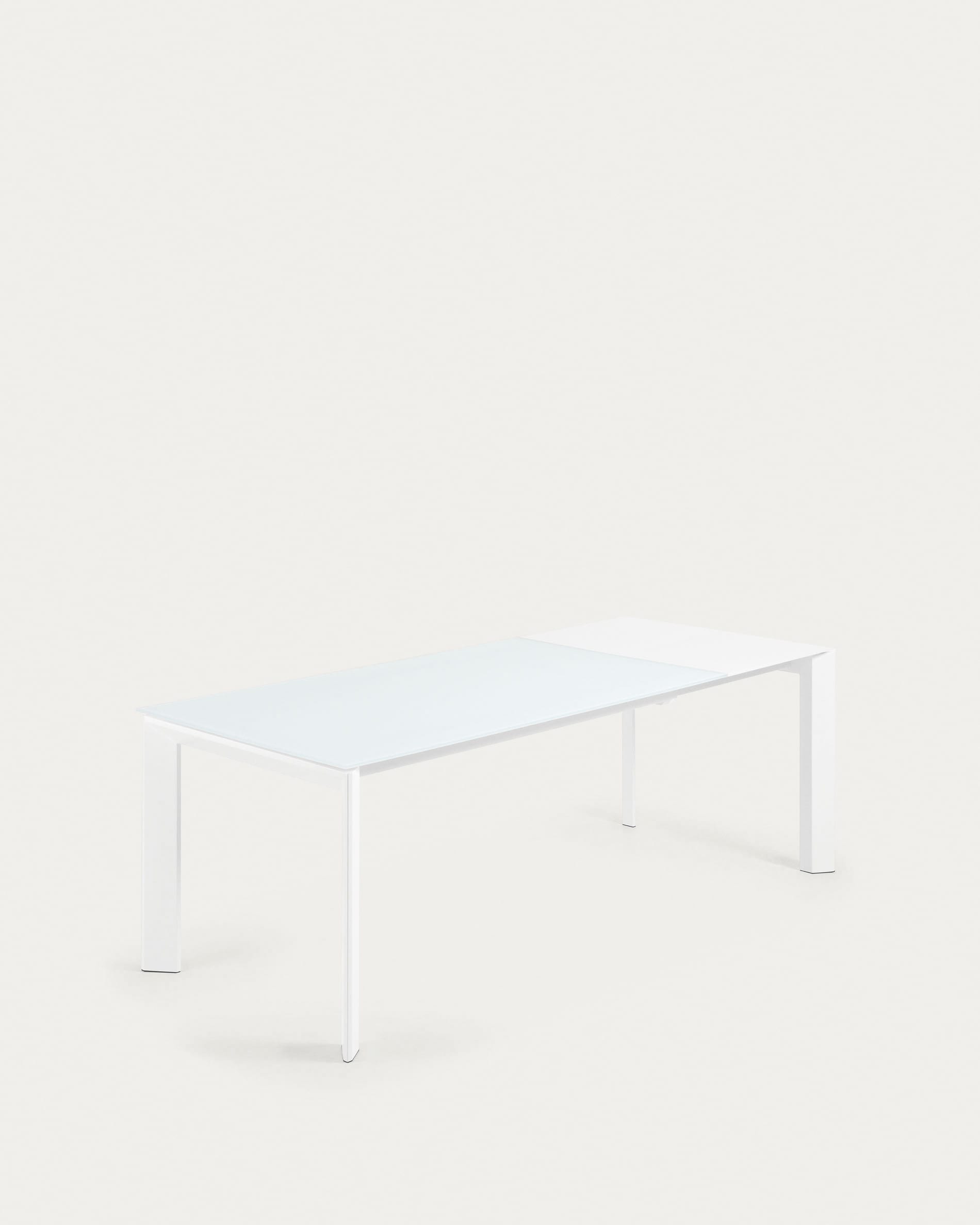 Eleganter Ausziehtisch mit Glasplatte und weissen Stahlbeinen, erweiterbar von 160 auf 220 cm.