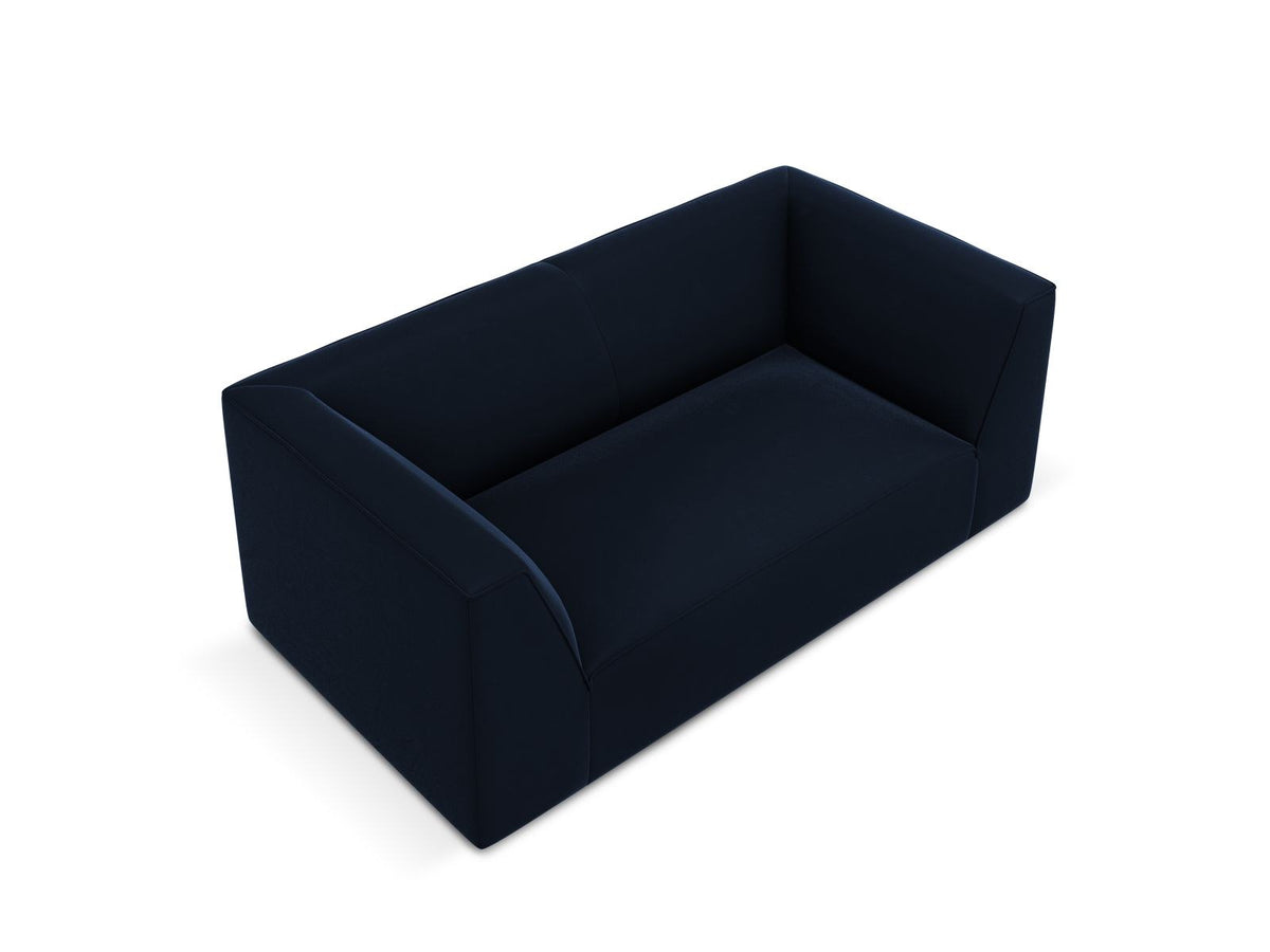 Zweisitzer-Sofa Siena in Beige-Salvador-Samt mit schwarzen Kunststoffbeinen, gepolsterter Sitzfläche und niedriger Rückenlehne, Frontansicht.