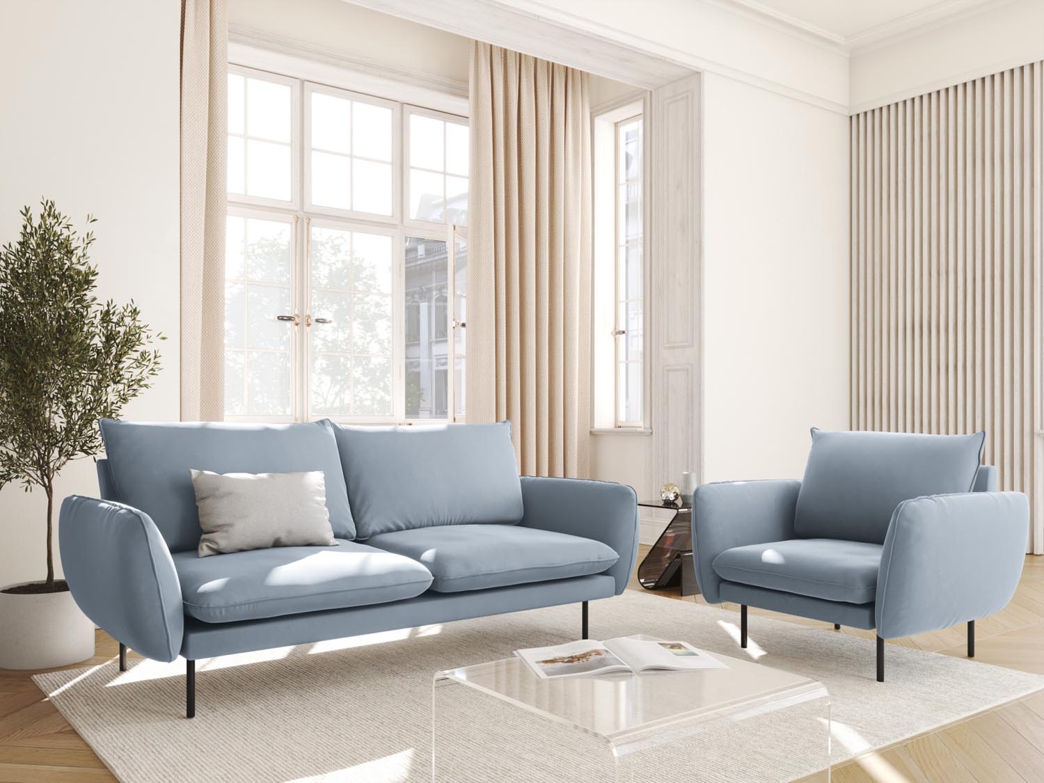 Eleganter Vienna Velour Sessel in sanftem Hellblau und Schwarz-Bluvel, ideal für stilvolle Wohnräume und gemütliche Entspannung.
