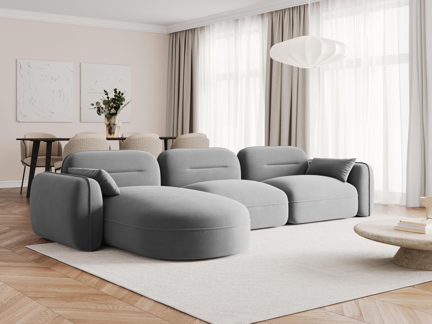 Elegantes Sydney Velour Ecksofa in Hellgrau, ideal für moderne Wohnräume, präsentiert in stilvollem Ambiente.