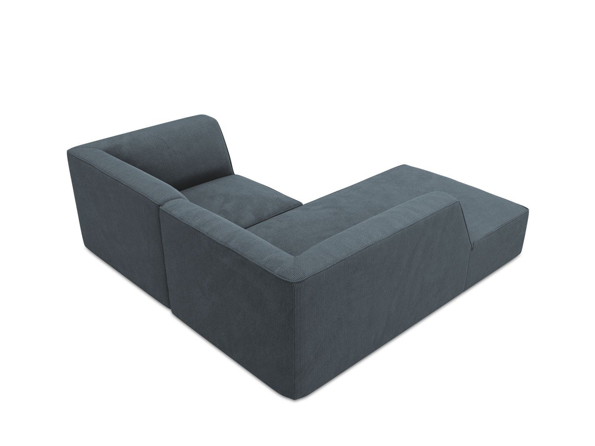 Modulares Ecksofa Siena mit gelbem Ottawa-Stoffbezug, schwarzen Kunststoffbeinen und Récamiere, Ansicht von vorne im Wohnraum.