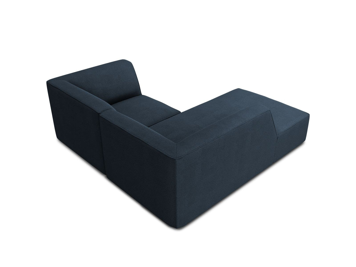 Modulares Ecksofa Siena mit gelbem Ottawa-Stoffbezug, schwarzen Kunststoffbeinen und Récamiere, Ansicht von vorne im Wohnraum.