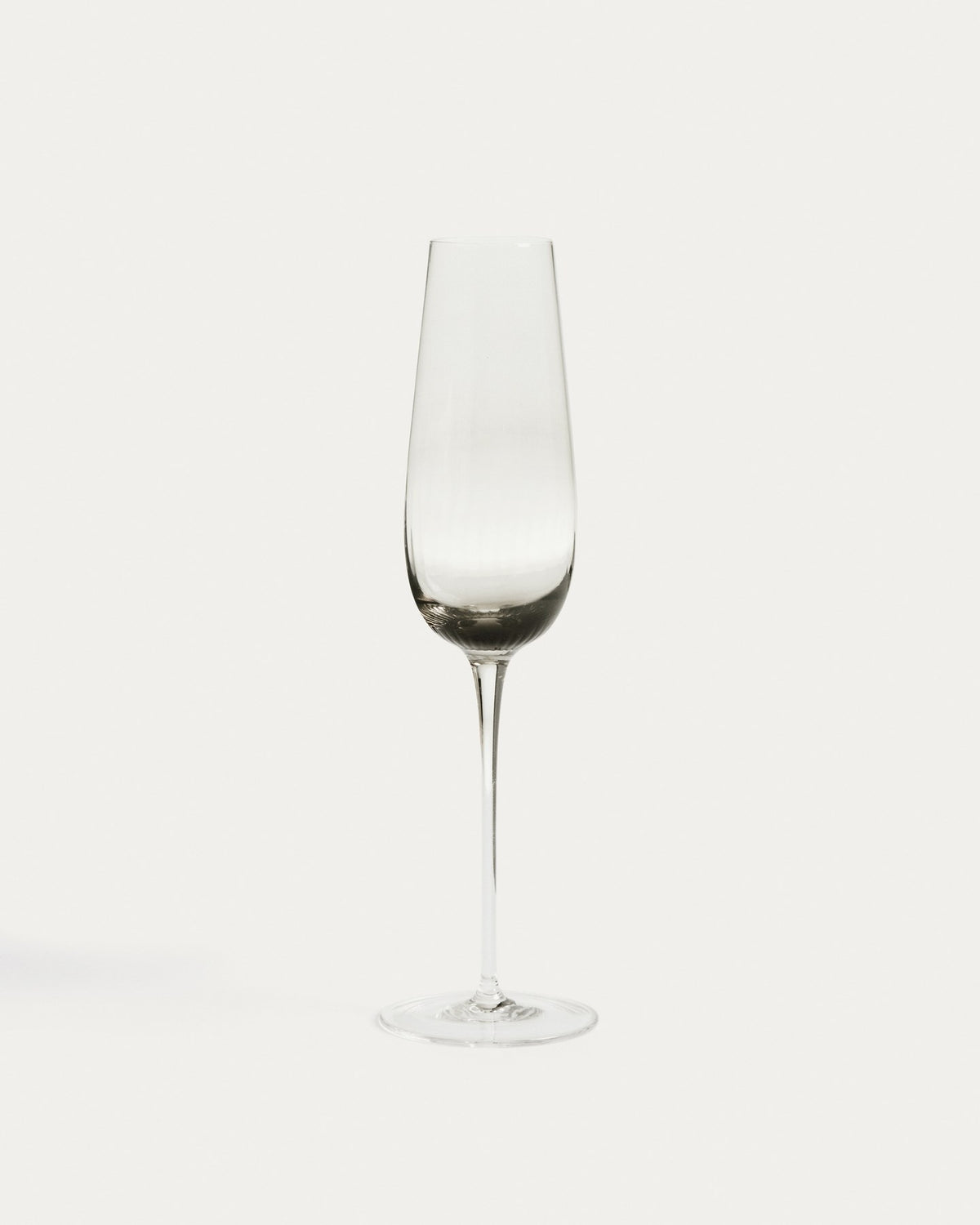 Sektglas Davel aus hellgrauem Glas mit abgerundetem Fuss und grauem Boden, Fassungsvermögen 21,5 cl, Höhe 27 cm.