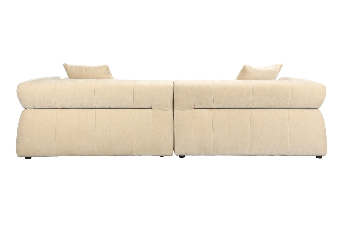 Beiges 5er Sofa Hodge von Dutchbone mit gestepptem Samtbezug, geschwungenen Armlehnen und leicht ausgestellten Rückenlehnen.